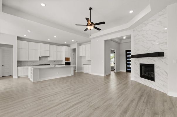 Empty room, Fireplace, Interior, Kitchen, Marble Walls, Recessed Lighting, Wood Texture Flooring