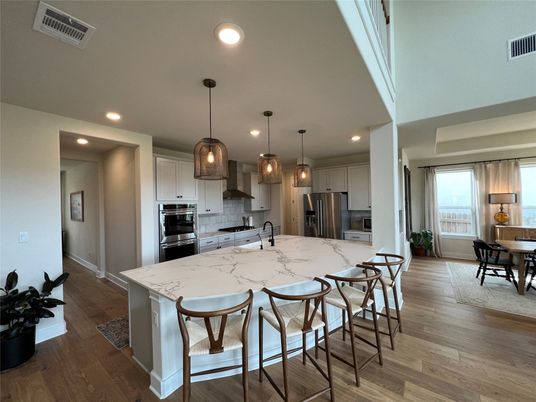 Dining room, Interior, Kitchen, Pendant Lights, Recessed Lighting, Stainless Steel Appliances, Wood Texture Flooring