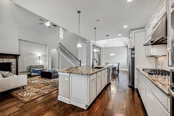 Dining room, Fireplace, Interior, Kitchen, Living room, Pendant Lights, Recessed Lighting, Wood Texture Flooring