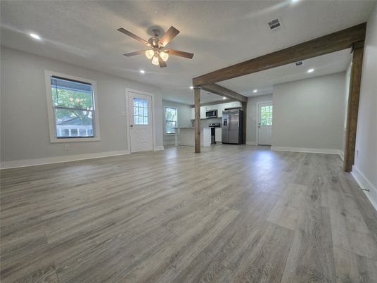Empty room, Interior, Kitchen, Recessed Lighting, Stainless Steel Appliances, Wooden Beams, Wood Texture Flooring