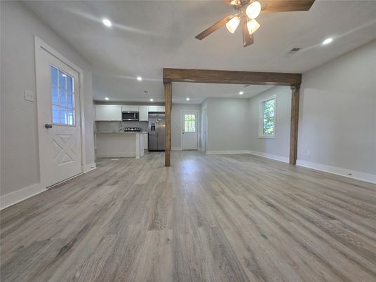 Empty room, Interior, Kitchen, Recessed Lighting, Stainless Steel Appliances, Wooden Beams, Wood Texture Flooring