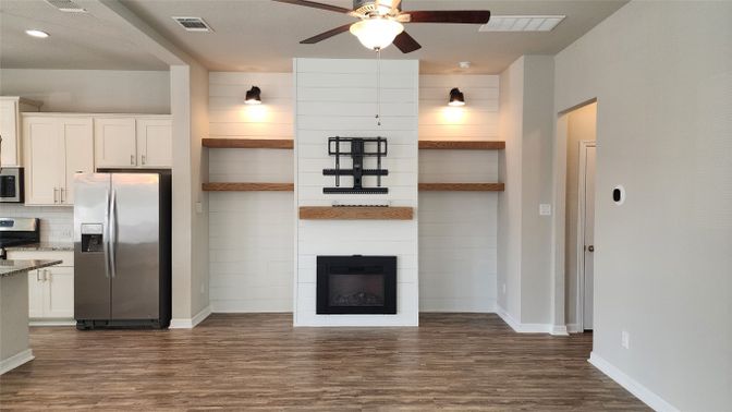 Fireplace, Interior, Kitchen, Recessed Lighting, Stainless Steel Appliances, Wood Texture Flooring