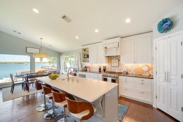 Dining room, Interior, Kitchen, Pendant Lights, Recessed Lighting, Stainless Steel Appliances, Water, Wood Texture Flooring