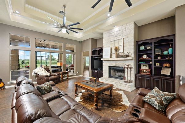 Fireplace, Interior, Living room, Recessed Lighting, Stone Walls, Wood Texture Flooring