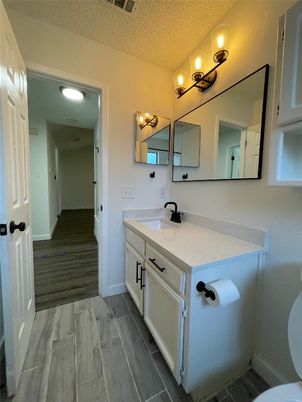 Bathroom, Dual Sink Vanities, Interior, Recessed Lighting, Wood Texture Flooring
