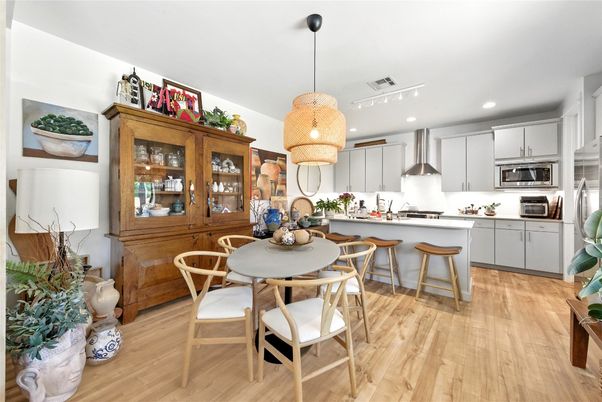 Dining room, Interior, Kitchen, Pendant Lights, Recessed Lighting, Stainless Steel Appliances, Wood Texture Flooring
