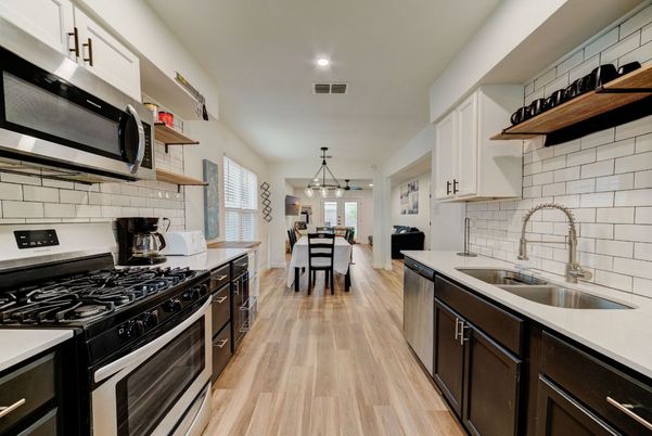 Dining room, Interior, Kitchen, Pendant Lights, Recessed Lighting, Stainless Steel Appliances, Wood Texture Flooring