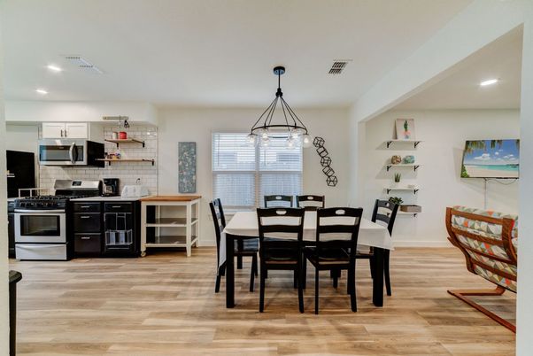 Dining room, Interior, Kitchen, Pendant Lights, Recessed Lighting, Stainless Steel Appliances, Wood Texture Flooring
