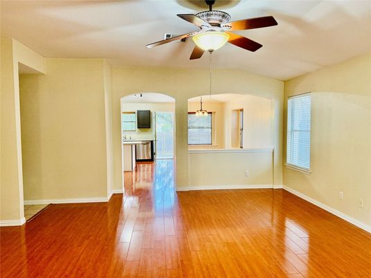 Empty room, Interior, Kitchen, Pendant Lights, Stainless Steel Appliances, Wood Texture Flooring