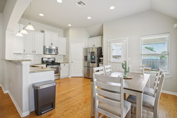Dining room, Interior, Kitchen, Pendant Lights, Recessed Lighting, Stainless Steel Appliances, Wood Texture Flooring