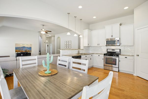 Dining room, Interior, Kitchen, Pendant Lights, Recessed Lighting, Stainless Steel Appliances, Wood Texture Flooring
