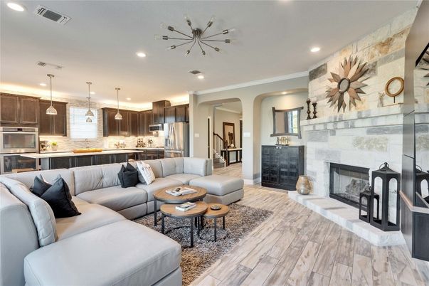 Fireplace, Interior, Kitchen, Living room, Pendant Lights, Recessed Lighting, Stainless Steel Appliances, Stone Walls, Wood Texture Flooring