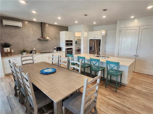 Dining room, Interior, Kitchen, Pendant Lights, Recessed Lighting, Stainless Steel Appliances, Wood Texture Flooring