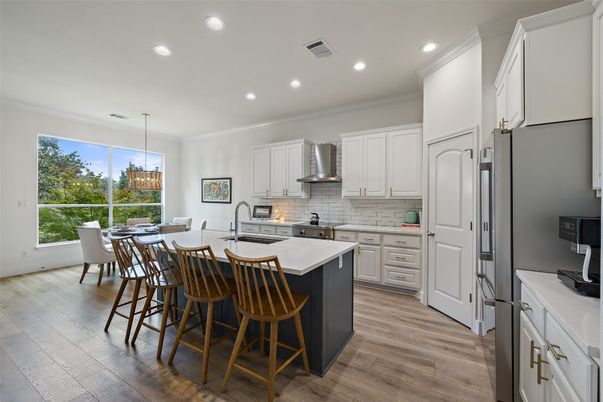 Dining room, Interior, Kitchen, Pendant Lights, Recessed Lighting, Stainless Steel Appliances, Wood Texture Flooring