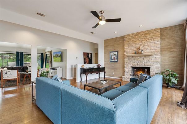 Fireplace, Interior, Living room, Recessed Lighting, Stone Walls, Wood Texture Flooring
