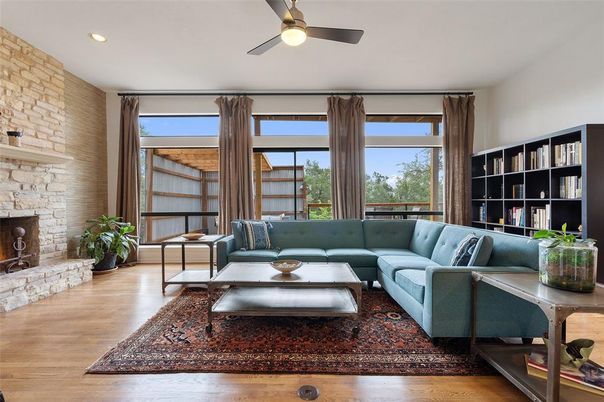 Fireplace, Interior, Living room, Recessed Lighting, Stone Walls, Wood Texture Flooring