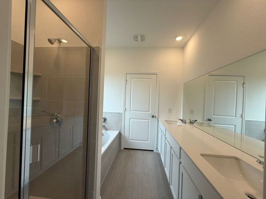Bathroom, Dual Sink Vanities, Glass Shower, Interior, Recessed Lighting, Wood Texture Flooring