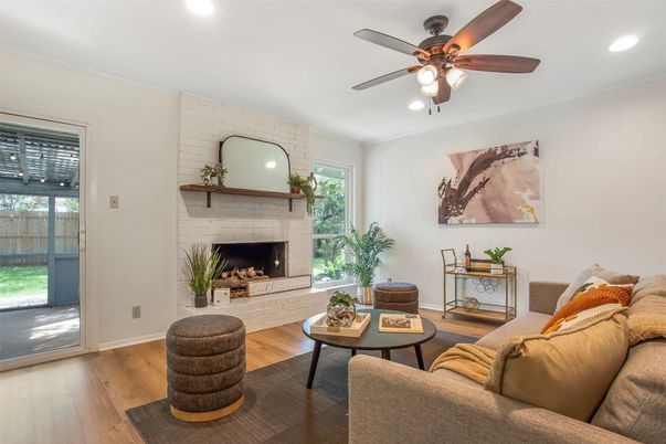 Fireplace, Interior, Living room, Recessed Lighting, Stone Walls, Wood Texture Flooring