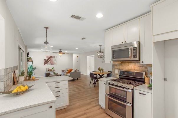 Dining room, Interior, Kitchen, Living room, Pendant Lights, Recessed Lighting, Stainless Steel Appliances, Wood Texture Flooring
