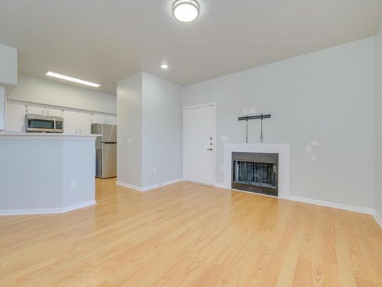 Empty room, Fireplace, Interior, Kitchen, Recessed Lighting, Wood Texture Flooring