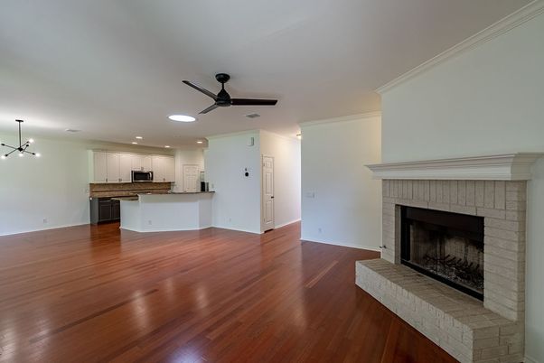 Empty room, Fireplace, Interior, Kitchen, Pendant Lights, Recessed Lighting, Wood Texture Flooring