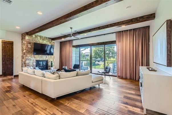 Fireplace, Interior, Living room, Recessed Lighting, Stone Walls, Wood Texture Flooring