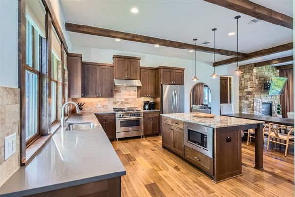 Interior, Kitchen, Pendant Lights, Recessed Lighting, Stainless Steel Appliances, Stone Walls, Wooden Beams, Wood Texture Flooring