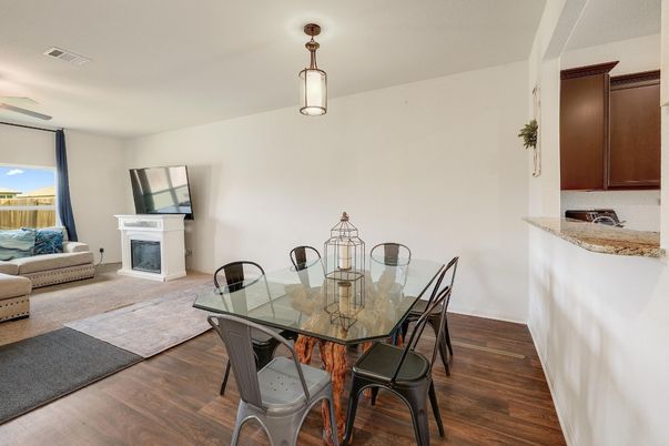 Dining room, Fireplace, Interior, Pendant Lights, Wood Texture Flooring