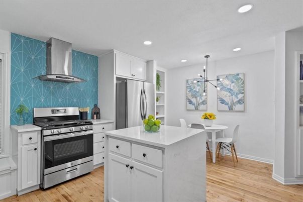 Dining room, Interior, Kitchen, Pendant Lights, Recessed Lighting, Stainless Steel Appliances, Wood Texture Flooring