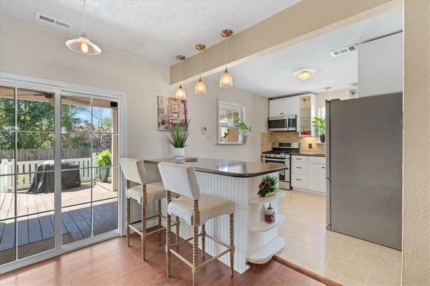 Dining room, Interior, Kitchen, Pendant Lights, Stainless Steel Appliances, Wood Texture Flooring