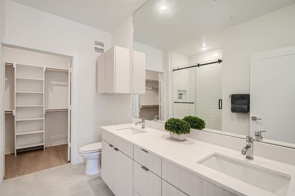 Bathroom, Dual Sink Vanities, Glass Shower, Interior, Recessed Lighting, Walk-in Closets, Wood Texture Flooring
