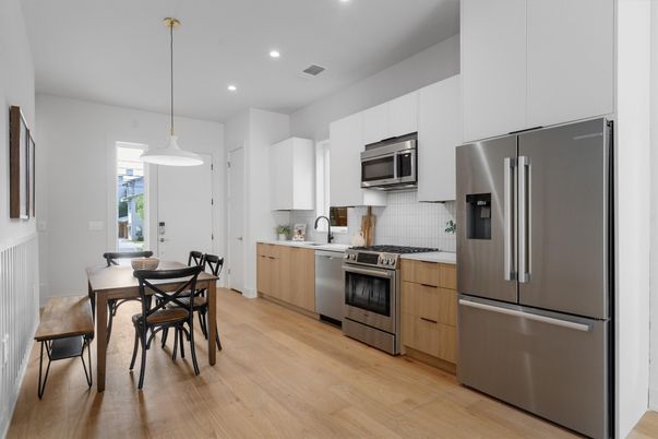 Dining room, Interior, Kitchen, Pendant Lights, Recessed Lighting, Stainless Steel Appliances, Wood Texture Flooring