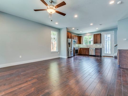 Empty room, Interior, Kitchen, Recessed Lighting, Stainless Steel Appliances, Wood Texture Flooring
