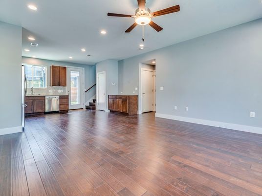 Empty room, Interior, Kitchen, Recessed Lighting, Stainless Steel Appliances, Wood Texture Flooring