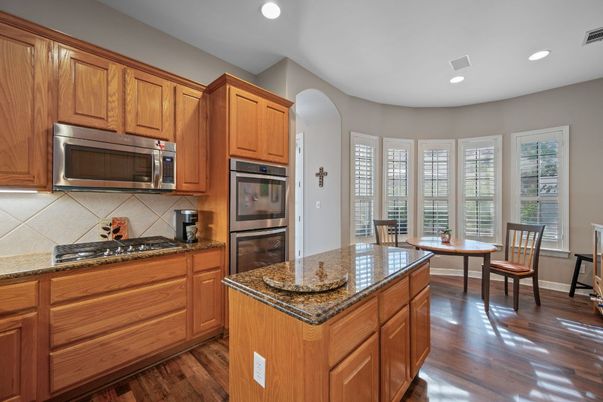 Dining room, Interior, Kitchen, Recessed Lighting, Stainless Steel Appliances, Wood Texture Flooring