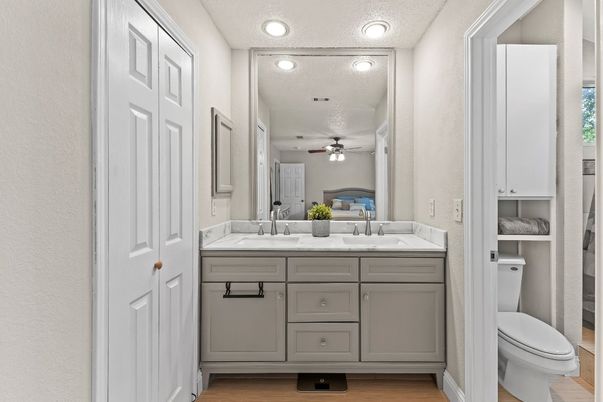 Bathroom, Dual Sink Vanities, Interior, Recessed Lighting, Wood Texture Flooring