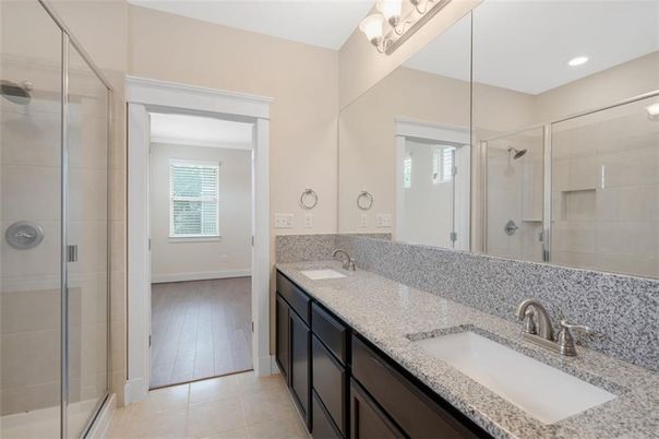 Bathroom, Dual Sink Vanities, Glass Shower, Interior, Recessed Lighting, Wood Texture Flooring