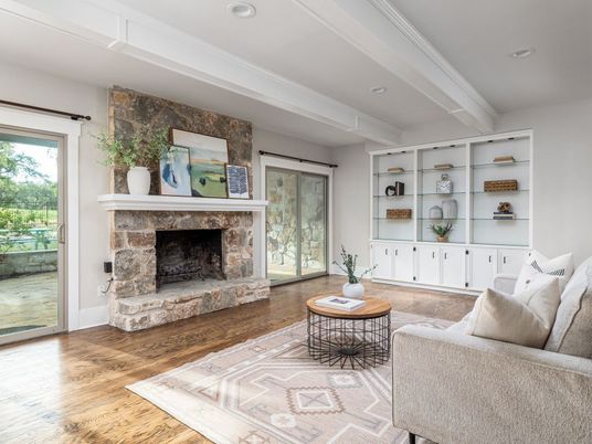 Fireplace, Interior, Living room, Recessed Lighting, Stone Walls, Wood Texture Flooring
