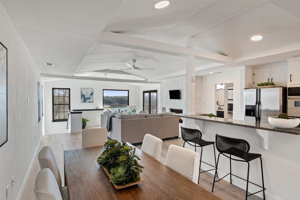 Dining room, Fireplace, Interior, Kitchen, Living room, Recessed Lighting, Stainless Steel Appliances, Wood Texture Flooring