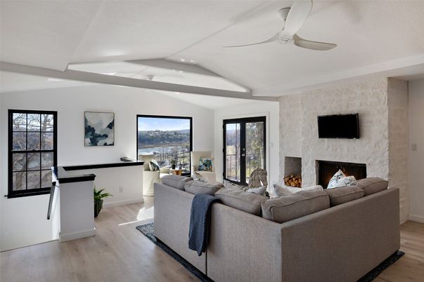 Fireplace, Interior, Living room, Recessed Lighting, Stone Walls, Wood Texture Flooring