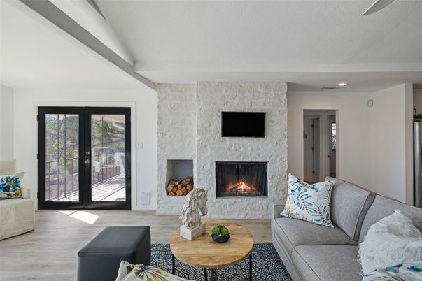Fireplace, Interior, Living room, Recessed Lighting, Stone Walls, Wood Texture Flooring