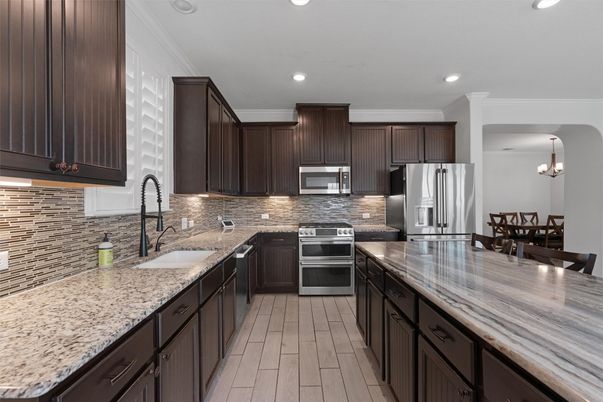 Chandelier, Interior, Kitchen, Pendant Lights, Recessed Lighting, Stainless Steel Appliances, Wood Texture Flooring