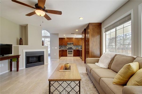 Fireplace, Interior, Kitchen, Living room, Recessed Lighting, Stainless Steel Appliances, Wood Texture Flooring