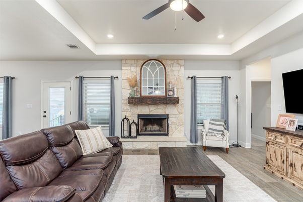 Fireplace, Interior, Living room, Recessed Lighting, Stone Walls, Wood Texture Flooring
