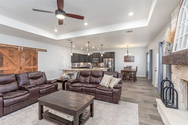 Dining room, Fireplace, Interior, Kitchen, Living room, Pendant Lights, Recessed Lighting, Stainless Steel Appliances, Stone Walls, Wood Texture Flooring