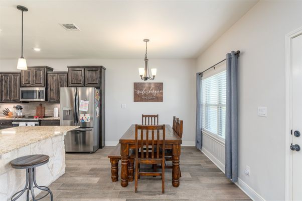 Chandelier, Dining room, Interior, Kitchen, Pendant Lights, Recessed Lighting, Stainless Steel Appliances, Wood Texture Flooring