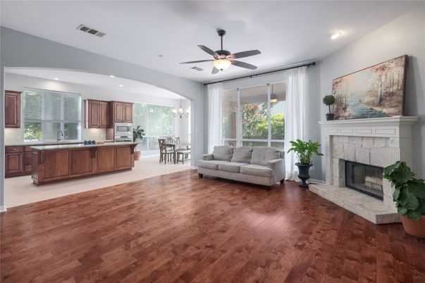Chandelier, Dining room, Fireplace, Interior, Kitchen, Living room, Recessed Lighting, Wood Texture Flooring