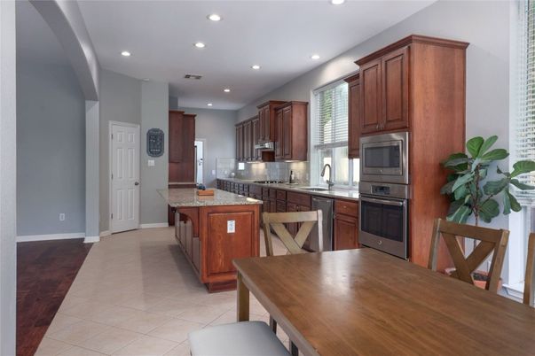 Dining room, Interior, Kitchen, Recessed Lighting, Stainless Steel Appliances, Wood Texture Flooring