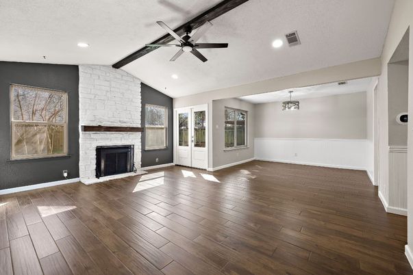 Empty room, Fireplace, Interior, Recessed Lighting, Stone Walls, Wood Texture Flooring