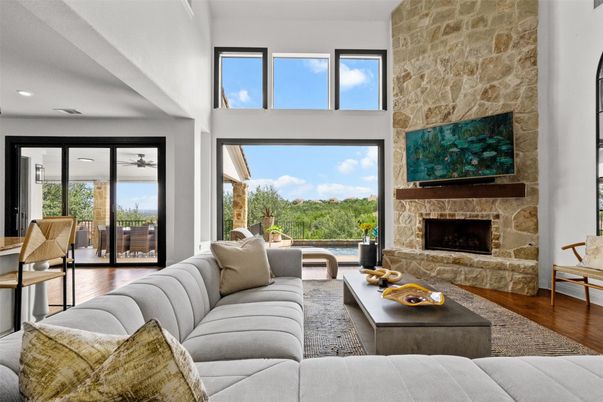 Fireplace, Interior, Living room, Recessed Lighting, Stone Walls, Wood Texture Flooring
